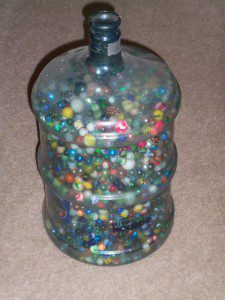 57 POUNDS OF MARBLES.